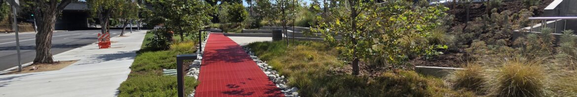 Red pathway through landscaped grounds