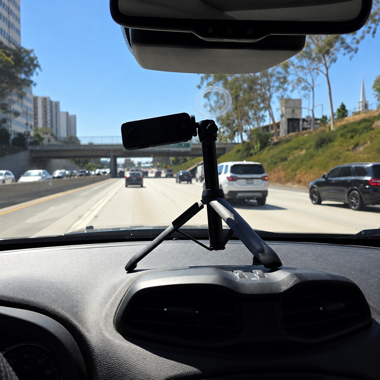 Dashboard-mounted camera on a tripod