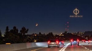 A crescent moon above nighttime freeway traffic and city lights with a small gold Presence logo in the upper right.