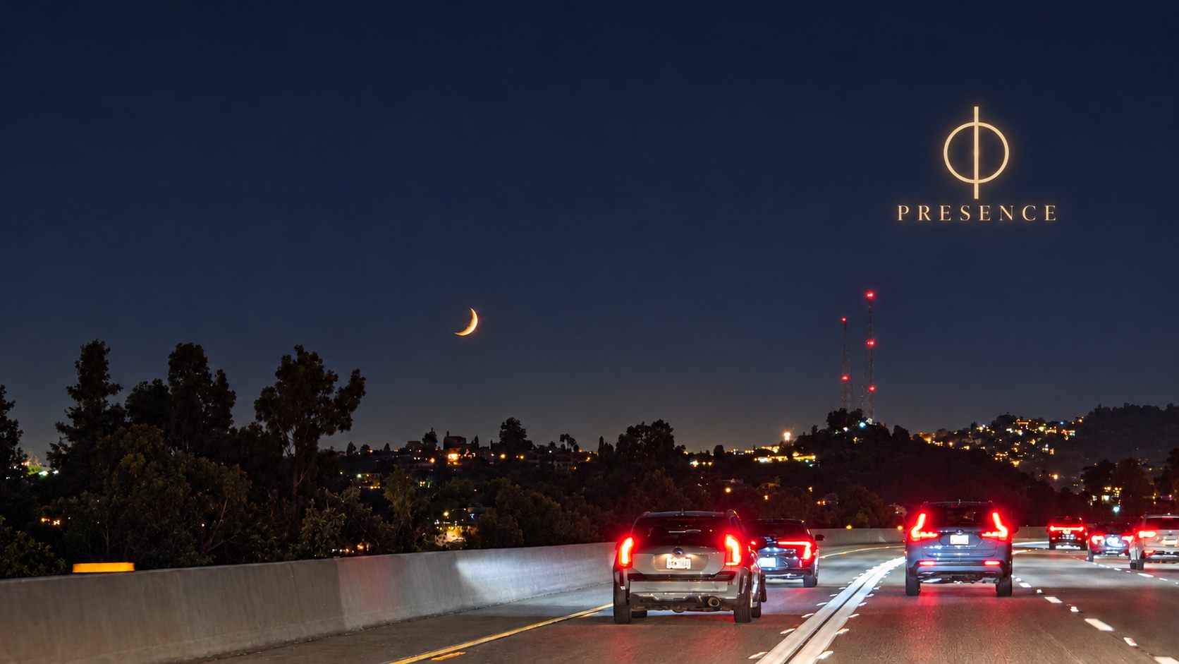 Enhanced crescent moon city photograph with the crescent moon, freeway traffic, hillside lights, and communication towers.