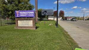 Youngstown Community School sign and Youngstown street scene